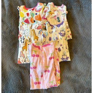 Bundle of baby girl sleepers.